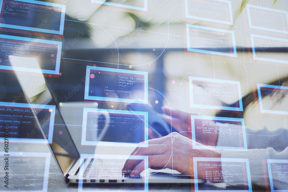 Leinwandbilder Close up of businessman hands using laptop and cellphone with abstract creative coding programming at desktop on blurry outdoor background. Science, technology and software concept. Double exposure.