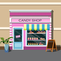 facade of a pink candy store with an attractive showcase with pastries