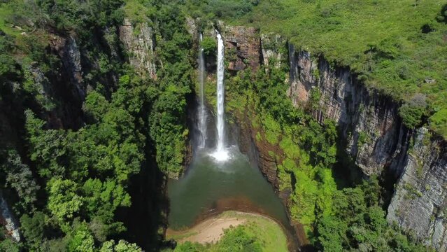 Drone shot of Mac Mac Fall in South Africa - drone is reversing from the waterfall, revealing the valley. Snippet could ideally be used for travel or hiking related videos or South Africa movies.