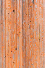 Vintage fence of old wooden boards. Texture of an aging wooden surface. Beautiful wooden background.