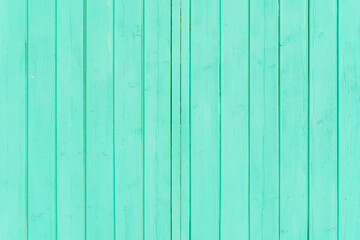 Naklejka premium Vintage fence of old wooden boards. Texture of an aging wooden surface. Beautiful wooden background.