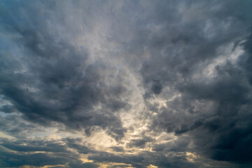Fototapeta na wymiar Dark gloomy clouds on a stormy sky. Natural atmospheric background.