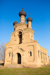 Old ruined church. Bent crosses and broken walls of the temple, ancient forged frames on the...