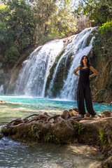 A woman tourist in Cascadas de Chiflón, a beautiful waterfall in the park. Mexico