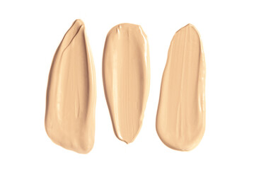 Fototapeta premium Foundation with smears as a sample on a white background. Makeup cosmetics. Tone cream. Concealer texture.