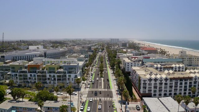 Aerial Forward Shot Of Men Riding Motorbikes At Global Charity Event By Beach In City - Santa Monica, California