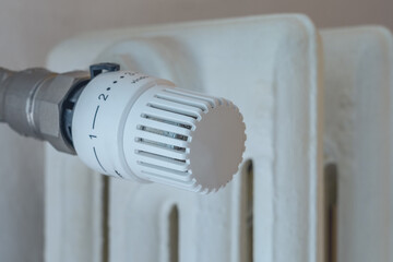 Home thermostatic radiator valve. Ecology and climate change concept.