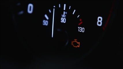 Real car temperature gauge. White gauges over black background. Check your engine concept. High quality photo