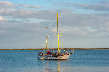 Sailing boat at the harbor in front of Olhao in the Algarve