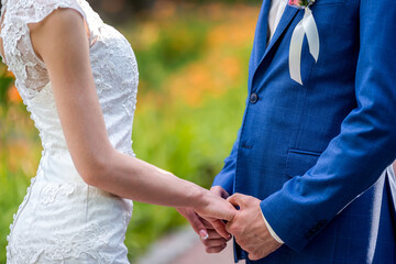 Romantic couple wedding hands close up. Outdoor bridal love hands.