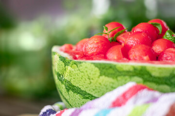 sweet and juicy watermelon small balls, served using the skin as a bowl. Summer food concept. Selective focus