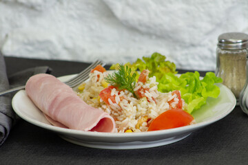 salad rice on a plate with a slice of ham