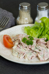 cervelas salad in a plate on a table