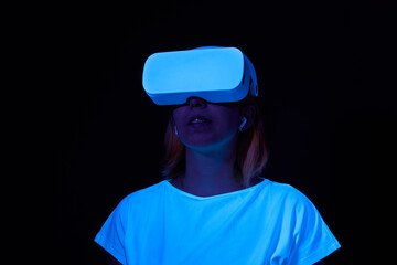 Woman interting with virtual reality using vr headset.