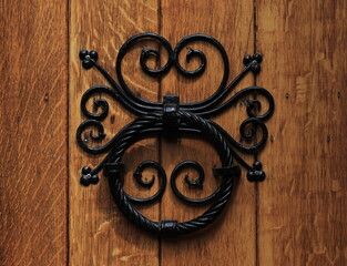 Wooden Door Detail with Black Iron Handle at the Posthoornkerk Church in Amsterdam, Netherlands