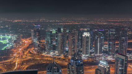 JLT and Dubai marina skyscrapers near Sheikh Zayed Road aerial night timelapse. Residential buildings