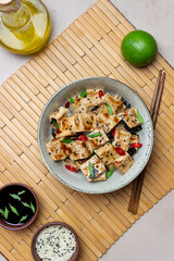 Tofu in teriyaki sauce with green onions, chili peppers and sesame. Asian food. Vegetarian food. Healthy eating.