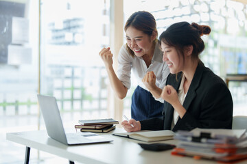 Successful business team excited when her business growth. Finance concept.