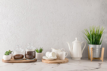 various kitchen utensils on a marble white countertop. modern kitchen decor concept. an empty space for your text.
