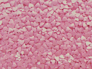 textured background, lots of small decorative candy pink hearts