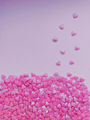 textured background, lots of small decorative candy pink hearts