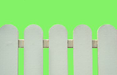 Wooden fence painted white attached to iron.