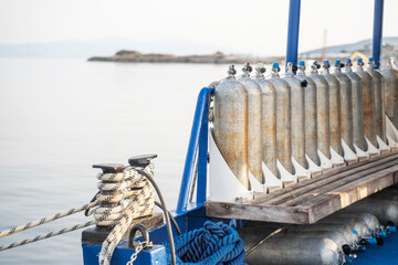Row of full oxygen tanks for scuba diving