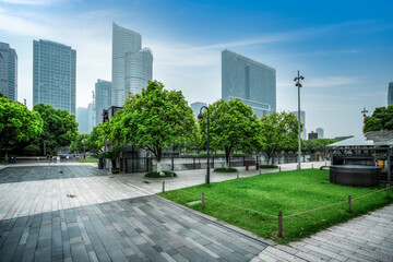 Street scene with green grass and modern buildings