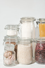 eco friendly kitchen storage. keeping food fresh, glass jars full of grains , pasta and flour....