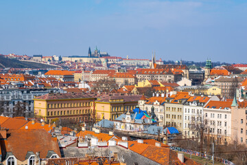 Fototapeta na wymiar Houses with traditional red roofs in Prague, Panoramic city skyline, Scenic aerial panorama of the Old Town architecture in Prague, Czech Republic