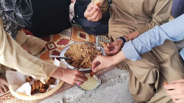 Group of people eating pakora Indian street food