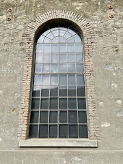 Fototapeta na wymiar Close up of window of restored former machine factory.