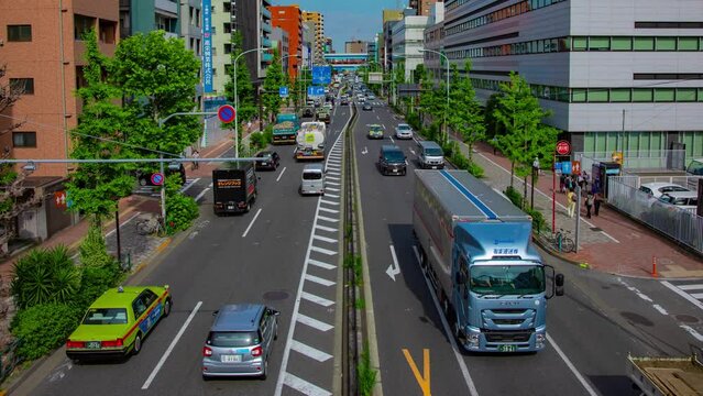 A timelapse of downtown street at Kanpachi avenue in Tokyo wide shot panning