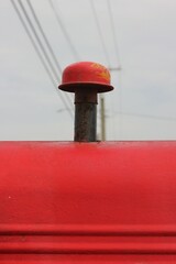 bright red tractor vent