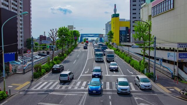 A timelapse of downtown street at Kanpachi avenue in Tokyo wide shot zoom