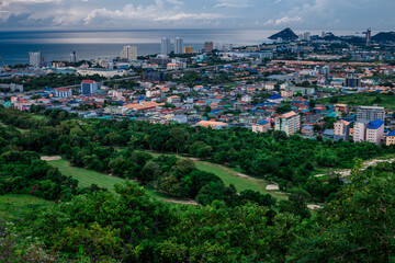 Background of mountains and nature surrounded, bright blue sky wallpaper. There are trees, green leaves, a beautiful ecology.