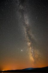 Fototapeta na wymiar A breathtaking view of the Milky Way at night in Arpi lake, Armenia