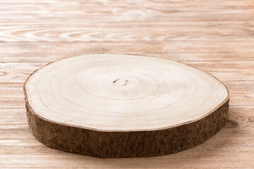 Perspective view of wooden serving tray on wooden background. Empty space for your design.