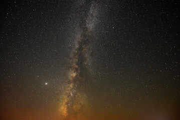 A breathtaking view of the Milky Way at night in Arpi lake, Armenia