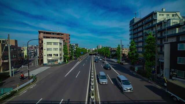 A timelapse of downtown street at Kanpachi avenue in Tokyo wide shot tilt
