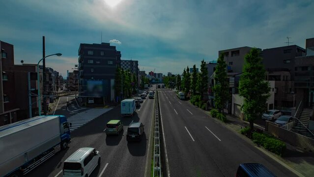A timelapse of downtown street at Kanpachi avenue in Tokyo wide shot zoom