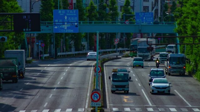 A timelapse of downtown street at Kanpachi avenue in Tokyo long shot tilt