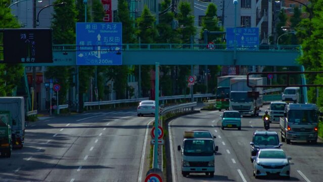 A timelapse of downtown street at Kanpachi avenue in Tokyo long shot zoom