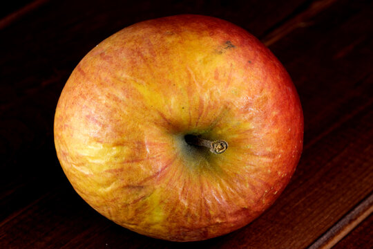 Spoiled shriveled rotten apple
