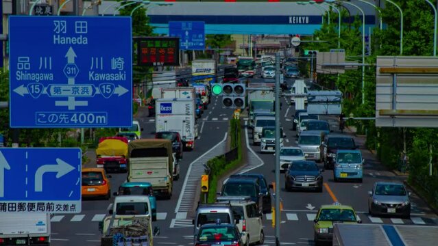 A timelapse of downtown street at Kanpachi avenue in Tokyo long shot tilt