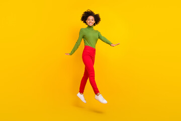 Fototapeta na wymiar Full body profile side photo of young cheerful girl jump dream travel isolated over yellow color background