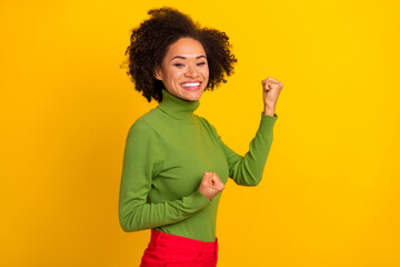 Profile side portrait of attractive lucky cheerful wavy-haired girl great success isolated over bright yellow color background