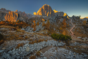 Autumn in the Italian Dolomites. The most beautiful time of the year to visit this place. Beautiful colors and breathtaking views. Mountain peaks above the valleys.