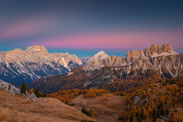 Autumn in the Italian Dolomites. The most beautiful time of the year to visit this place. Beautiful colors and breathtaking views. Mountain peaks above the valleys.