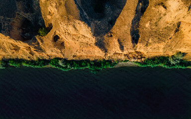 Top view of the sea coast with soil erosion